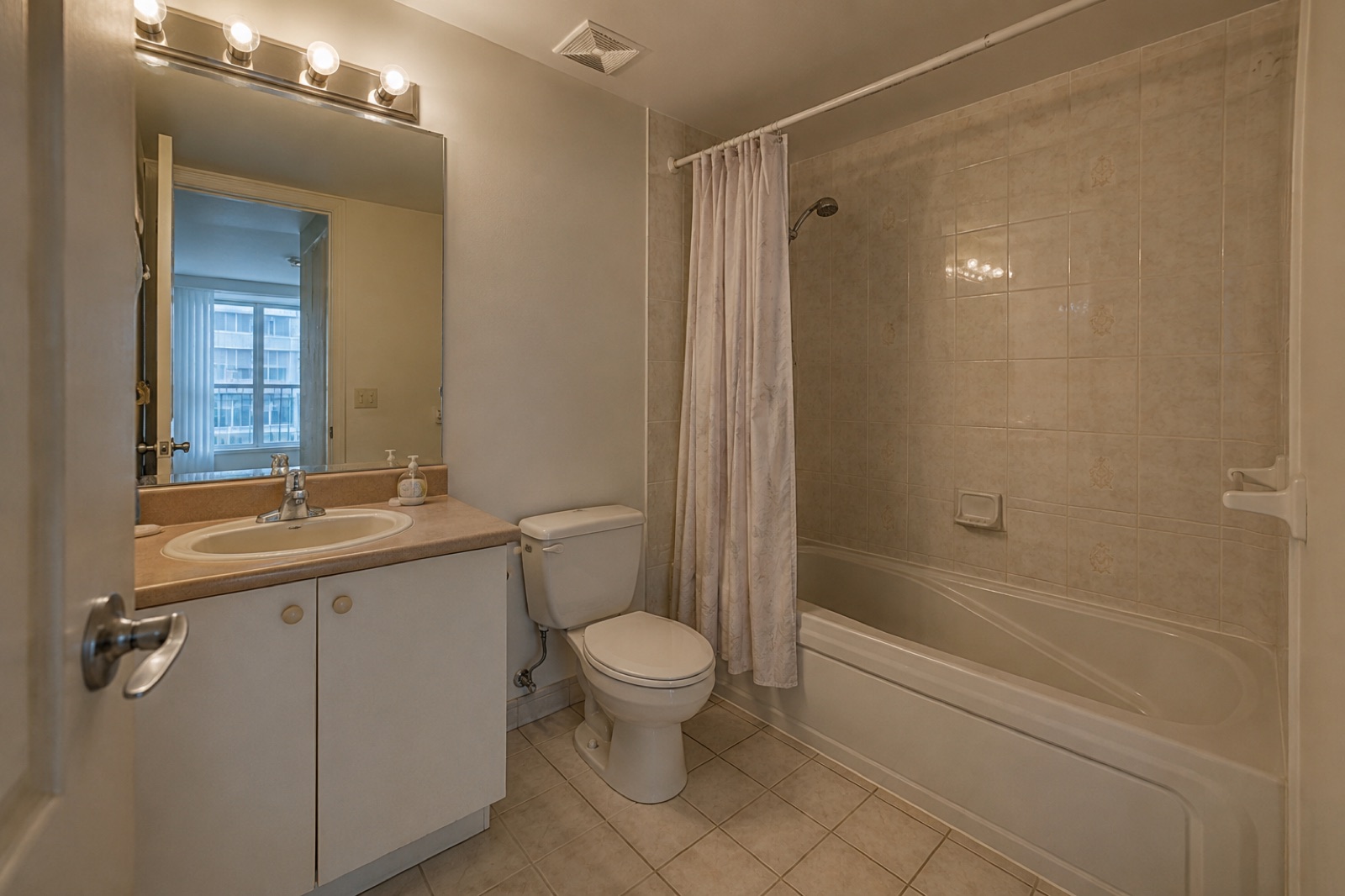 Before: dated bathroom prior to renovation, Toronto